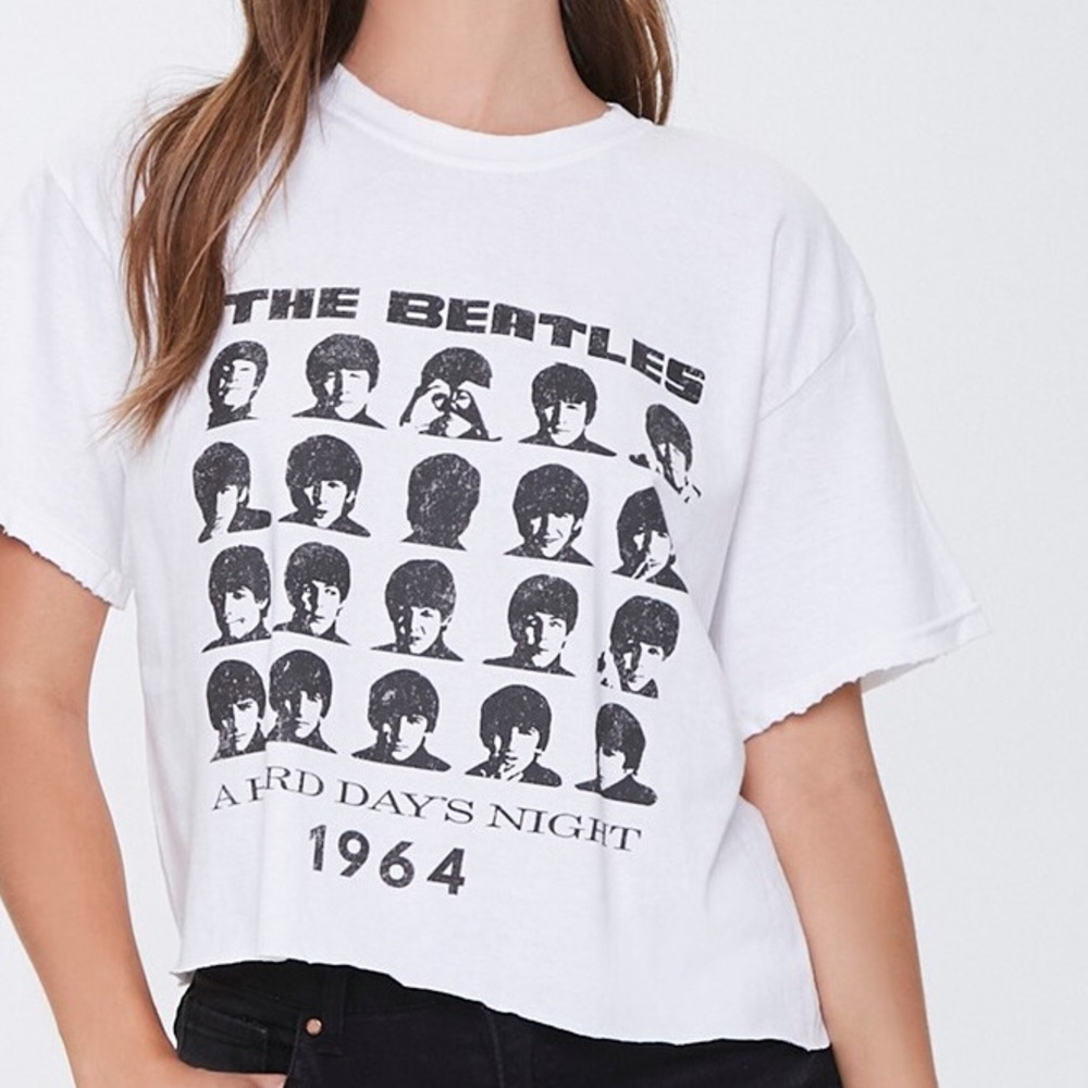 Size S/M Beatles crop-top. There’s a very small stain on the right shoulder.